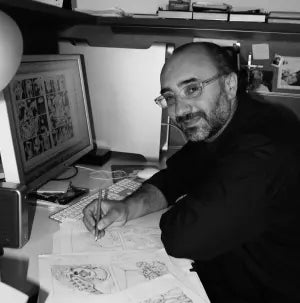 Ritratto dell'artista Pino Oliva nel suo studio a Matera mentre realizza illustrazioni e fumetti. Pino Oliva è un pittore e art director lucano specializzato in realismo onirico.